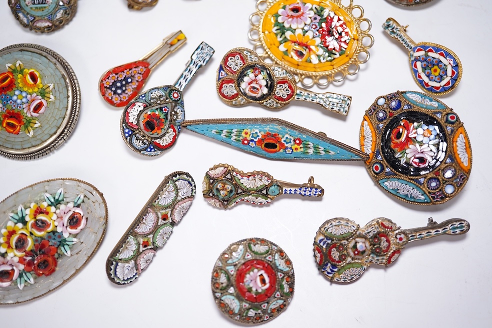 A collection of thirty-one micro-mosaic brooches, including fourteen mixed guitar and banjo shaped brooches, six large oval brooches and seven smaller brooches, three long brooches and a star shaped brooch. Condition - g